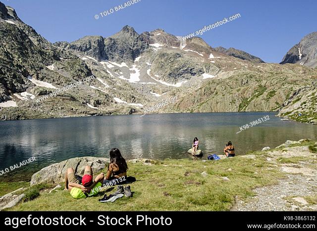 group of hikers relaxing, Ibones azules and Bachimaña alto route, Huesca province, Spain