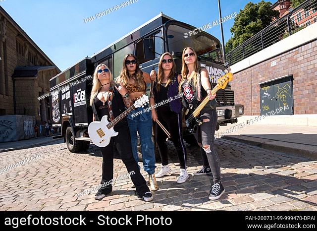 31 July 2020, Hamburg: The Swedish heavy metal band Thundermother, with Filippa Nässil (l-r), Guernica Mancini, Emlee Johansson and Majsan Lindberg stand at the...