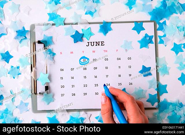 Mark on the Calendar 1st of June date. June 1, World Childrens Day. Flat lay. Top view. First day of summer holiday. Kids day