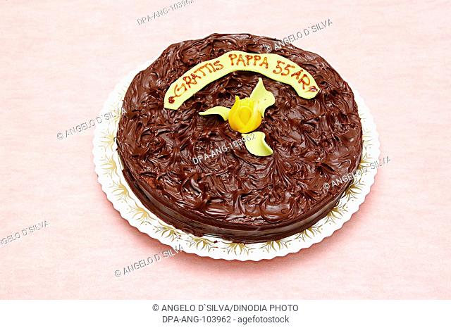 Food , Birthday truffle cake (Rich chocolate cake , icing made of whipped cream and melted chocolate) with marzipan rose and leaves gratis Pappa 55 Ary ( IN...