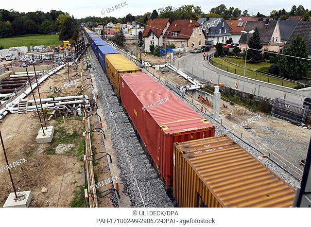 A freight train can be seen rushing by on the Rheintal railway route between Rastatt and Baden-Baden, near Niederbuehl, Germany, 2 October 2017