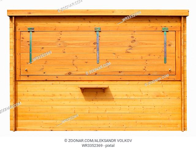 Front view of a closed street wooden city kiosk in which vegetables and fruits are sold. Isolated on white with patch