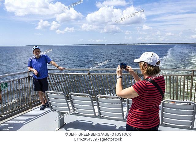 North Carolina, NC, Pamlico Sound, Outer Banks, Cedar Island, Ocracoke, ferry, boat, water, passengers, couple, posing, picture