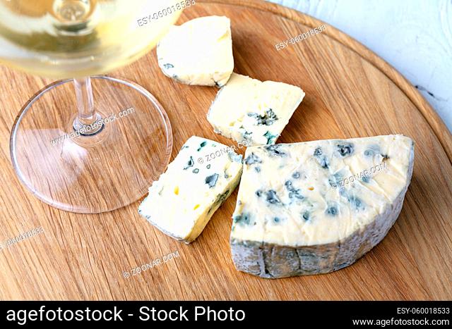 blue cheese on a wooden background