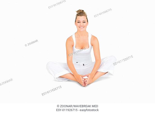 Woman sitting in bound angle yoga pose