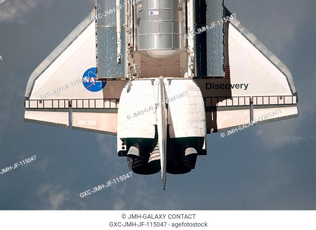 This partial view of the wing and aft part of the payload bay of the space shuttle Discovery was provided by an Expedition 26 crew member during a survey of the...