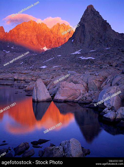 Thunderbolt Peak, North Palisade and Isosceles Peak reflected at sunset in one of the Dusy Lakes, Dusy Basin, Sierra Nevada, Kings Canyon National Park