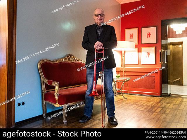 14 January 2020, Berlin: Nils Landgren, Swedish musician, is standing with his trombone in a hotel. Landgren will tour Germany from the end of March 2020