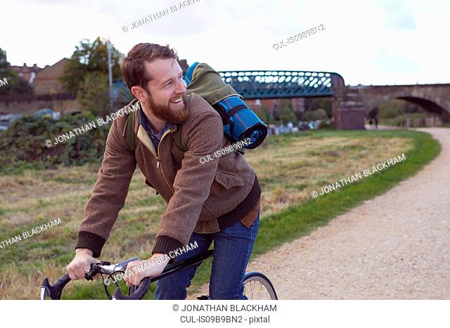 Man cycling on path