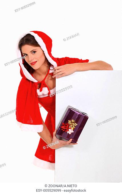 Cute Ms Santa with a gift and a board left blank for your message