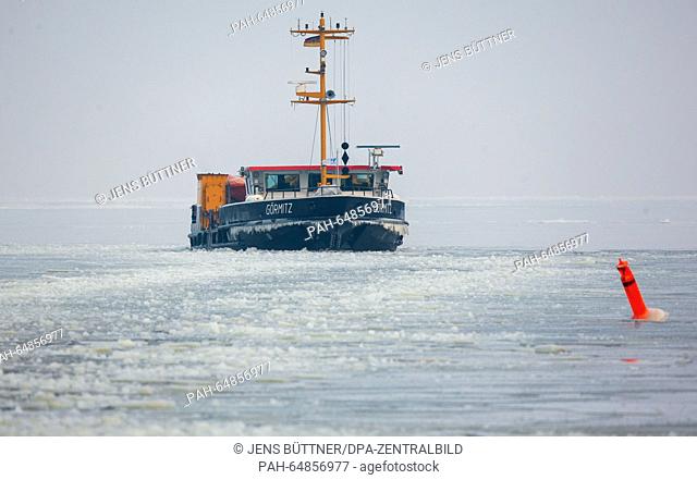 The buoy tender 'Goermitz' that is used as an icebreaker cracks an ice sheet measuring more than 15 centimetres on Szczecin Lagoon near Ueckermuende, Germany
