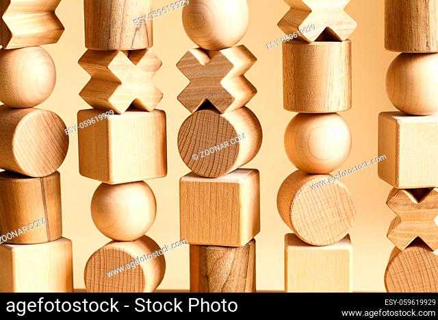 Children's wooden toys. Sequencing Blocks learning resource for educating shapes, fine motor skills, hand eye coordination, mathematical skills