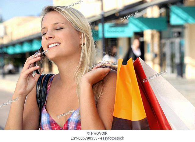 girl on the phone after shopping frenzy
