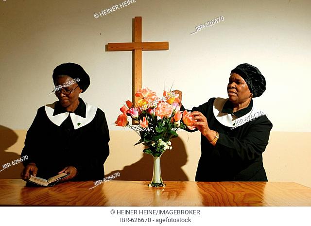 Nuns with flowers at the altar, Gaborone, Botswana, Africa