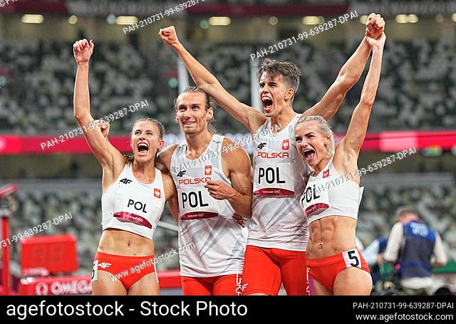 31 July 2021, Japan, Tokio: Athletics: Olympics, 4 x 400 m, Mixed, Final at Olympic Stadium. Poland's team celebrates after the race