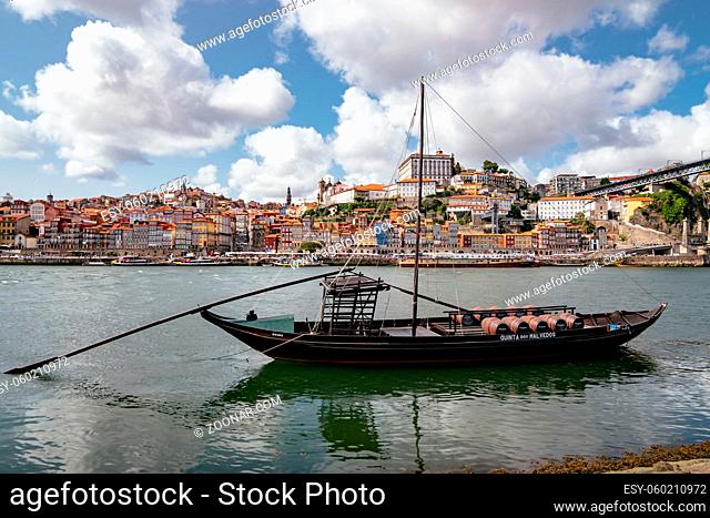 Panorama View of Ribeira with Traditional Boats and Dom Luís I Bridge in Douro River in Porto, Portugal