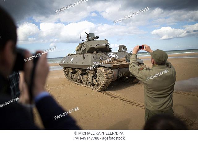 Military enthusiasts arrive before the D-Day anniversary celebrations to indulge their hobby at Omaha Beach in Vierville Sur Mer, France, 04 June 2014