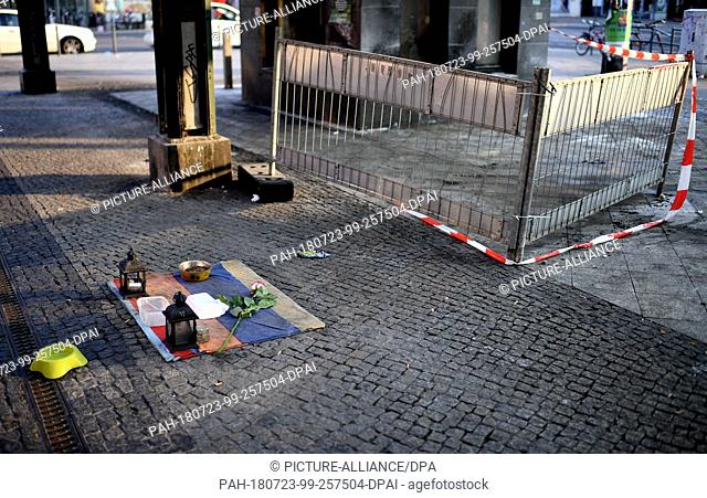 23 July 2018, Germany, Berlin: The few possessions of two homeless men remain at Cajamarcaplatz at the train station Schoeneweide