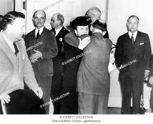 Secretary of Labor Frances Perkins in grief over the President's Franklin Roosevelt's death. April 12, 1945. She embraces Isidor Lupin