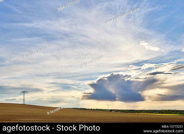 Germany, Mecklenburg-Western Pomerania, field corridor, clouds