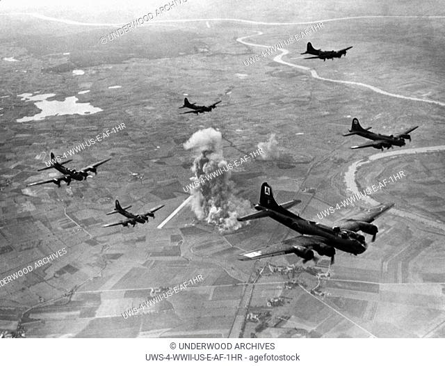 Marienburg, Germany, October 22, 1943 Smoke rises from the bombed Focke-Wulf aircraft fighter plant as B-17 Flying Fortresses of the US 8th Air Force Bomber...