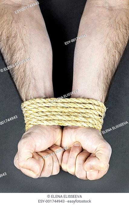 Wrists tied with rope