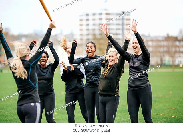 Female rounders team celebrating at rounders match