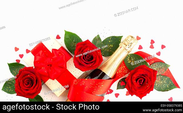 Valentines day composition flat lay top view with gift box rose flowers gift champagne and hearts design element isolated on white background with copy space...