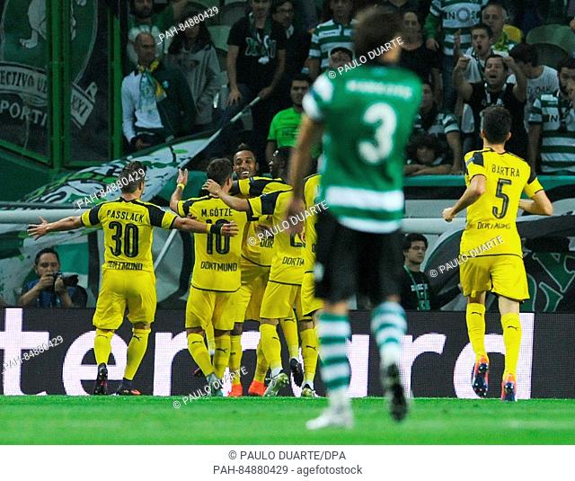 Pierre-Emerick Aubameyang (C) of Borussia Dortmund celebrates after scoring against of Sporting Lisbon during the UEFA Champions League Group F soccer match...