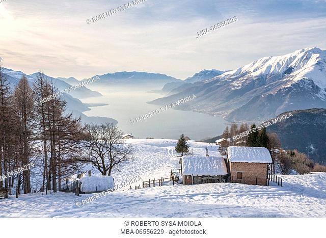 Winter view of Lake Como and mountain hut Vercana mountains High Lario Lombardy Italy Europe