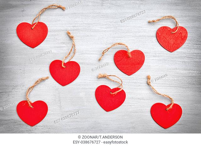 Love concept. Hearts on grey rustic background