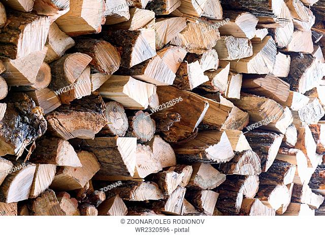 Woodpile from dry oak logs. Selective focus