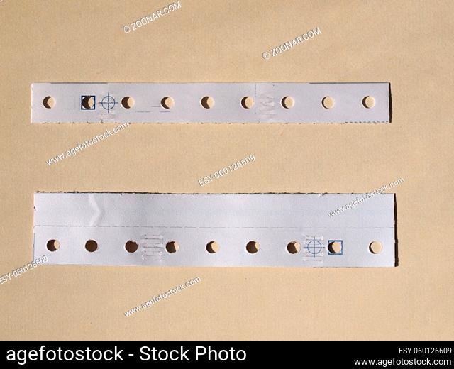 Perforated paper strips used in tabulated paper for computer prints
