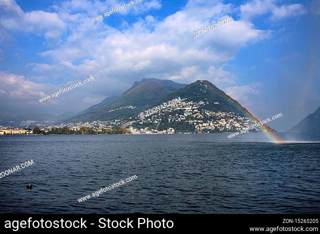 Water front with view of Lugano city and lake, Switzerland, with lake and mountains