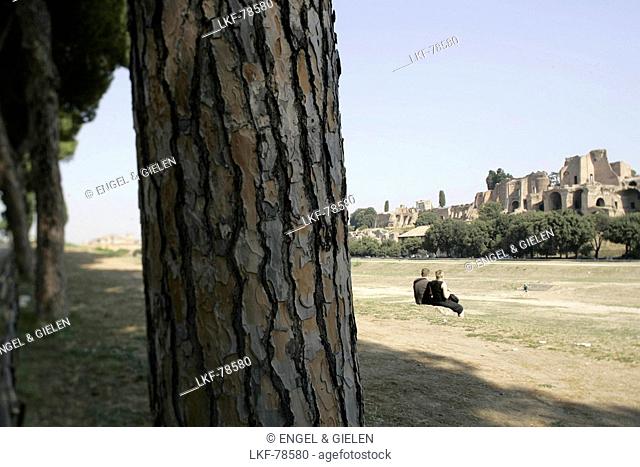 A couple sitting on the grass, Palatino, Circus Maximus, Rome, Italy