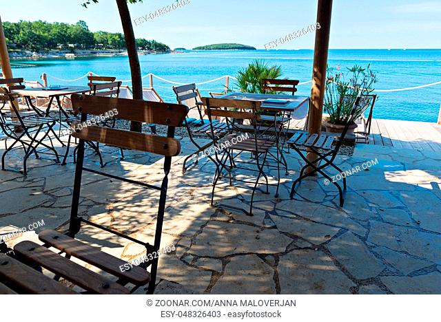 Chairs and tables with beautiful sea view in Istria, Croatian coast