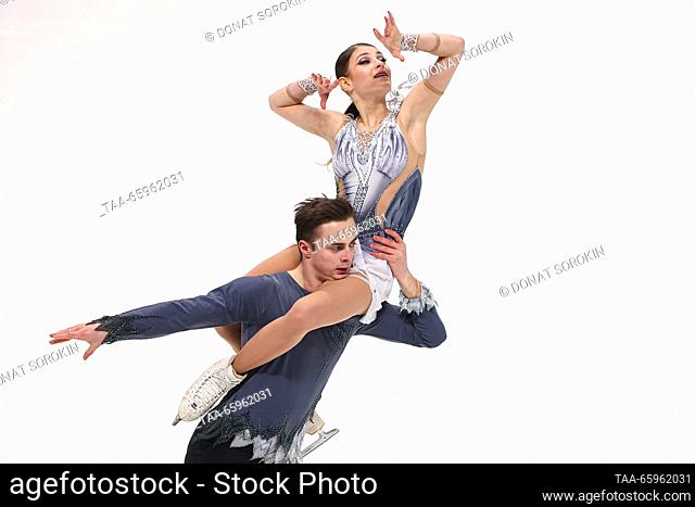 RUSSIA, CHELYABINSK - DECEMBER 21, 2023: Pair skaters Alyona Kostornaya and Georgy Kunitsa perform during a pairs' short programme event as part of the 2024...