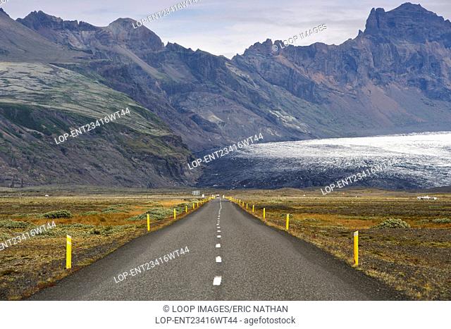 View of the Icelandic ring road leading to Skaftafell National Park and the Skaftafellsjokull glacier in a part of the massive Vatnajokull glacier in southeast...