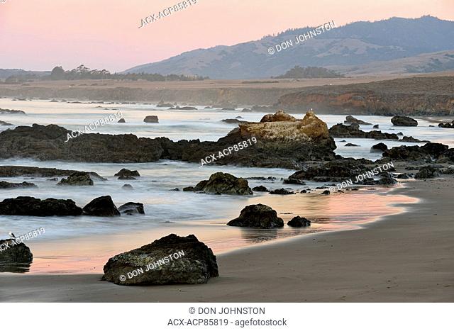 Rocky coastline at dawn on the California Coast, Morro Bay, California, USA