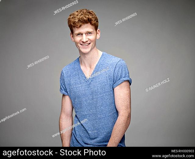 Portrait of laughing redheaded young man