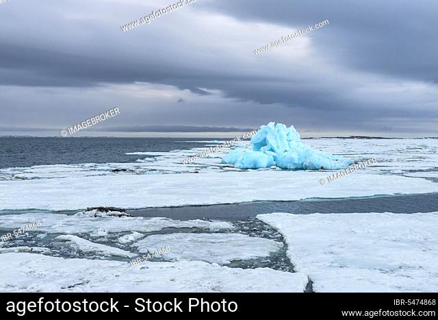 Blue iceberg drifting in Hinlopen Strait, Spitsbergen Island, Svalbard Archipelago, Norway, Europe