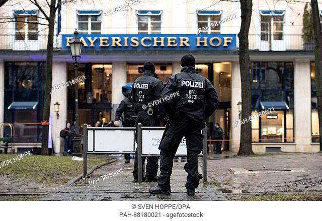 Police officers outside the Bayerischer Hof hotel which will host the Munich Security Conference in Munich, Germany, 17 February 2017