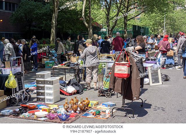 Shoppers search for bargains at the humongous 30th anniversary Penn South Flea Market in the New York neighborhood of Chelsea