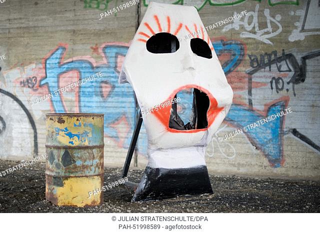 A stylized nuclear waste bin stands next to a mask in Bleckenstedt near Salzgitter, Germany, 17 September 2014. The central German final depository for low and...