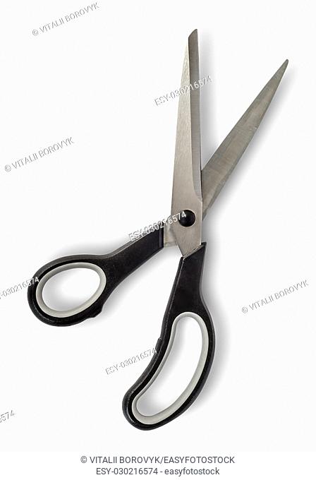 Disclosed big scissors with black handles isolated on white background