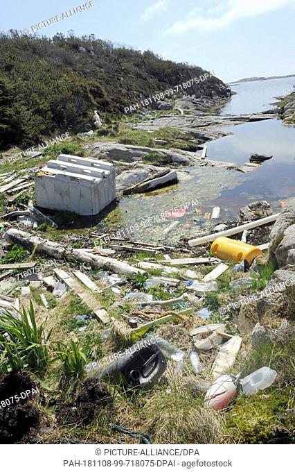 24 May 2018, Norway, Bergen: Garbage lies on a small island off the city of Bergen. For decades, the current has washed ashore here what people have carelessly...