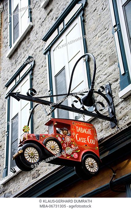 Shop sign at an old stone house in Québec City