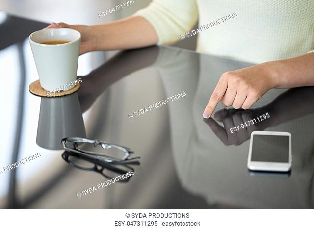 woman with coffee using black interactive panel