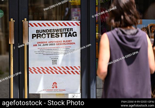 14 June 2023, Baden-Württemberg, Stuttgart: Protest posters hang outside the closed Solitude pharmacy in Stuttgart. Many pharmacies are to remain closed in...