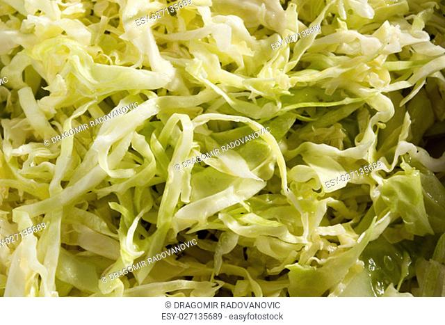Closeup of cabbage salad. Lots of green fresh cabbage sliced